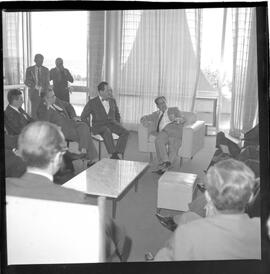 Fotografia "BSB; Brasília - Assembléia - Jango c/ deputados do Psd - Comissão de Inquérito - IBAD Leonel Brizola" ([Local n/d] , 1963) [negativo]. / Fotógrafo(a): Neville.  -- ITEM-0003.