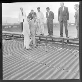 Fotografia "Visita do Lacerda ao Estádio do Maracanã c/ Antonio Carlos; LACERDA.. Carlos - visita Mstadio do Maracanã - para ver ver as obras - que foram iniciadas com Sete Camaras" ([Local n/d] , 1961) [negativo]. / Fotógrafo(a): Ribeiro.  -- ITEM-0002.