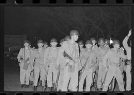 Fotografia "Conflitos' Conflitos - Passeatas - Polícia militar agride povo na Leopoldina - á favor das reformas de bases" ([Local n/d] , 1963) [negativo]. / Fotógrafo(a): Paulo; Venê; André; Alvaro; Pinto.  -- ITEM-0054.