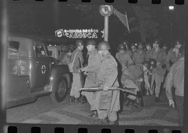 Fotografia "Conflitos' Conflitos - Passeatas - Polícia militar agride povo na Leopoldina - á favor das reformas de bases" ([Local n/d] , 1963) [negativo]. / Fotógrafo(a): Paulo; Venê; André; Alvaro; Pinto.  -- ITEM-0065.