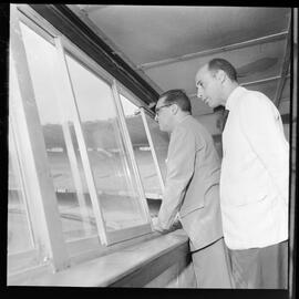 Fotografia "Visita do Lacerda ao Estádio do Maracanã c/ Antonio Carlos; LACERDA.. Carlos - visita Mstadio do Maracanã - para ver ver as obras - que foram iniciadas com Sete Camaras" ([Local n/d] , 1961) [negativo]. / Fotógrafo(a): Ribeiro.  -- ITEM-0010.