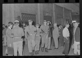 Fotografia "Conflitos' Conflitos - Passeatas - Polícia militar agride povo na Leopoldina - á favor das reformas de bases" ([Local n/d] , 1963) [negativo]. / Fotógrafo(a): Paulo; Venê; André; Alvaro; Pinto.  -- ITEM-0052.