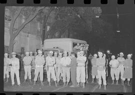 Fotografia "Conflitos' Conflitos - Passeatas - Polícia militar agride povo na Leopoldina - á favor das reformas de bases" ([Local n/d] , 1963) [negativo]. / Fotógrafo(a): Paulo; Venê; André; Alvaro; Pinto.  -- ITEM-0084.