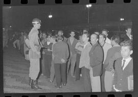 Fotografia "Conflitos' Conflitos - Passeatas - Polícia militar agride povo na Leopoldina - á favor das reformas de bases" ([Local n/d] , 1963) [negativo]. / Fotógrafo(a): Paulo; Venê; André; Alvaro; Pinto.  -- ITEM-0023.